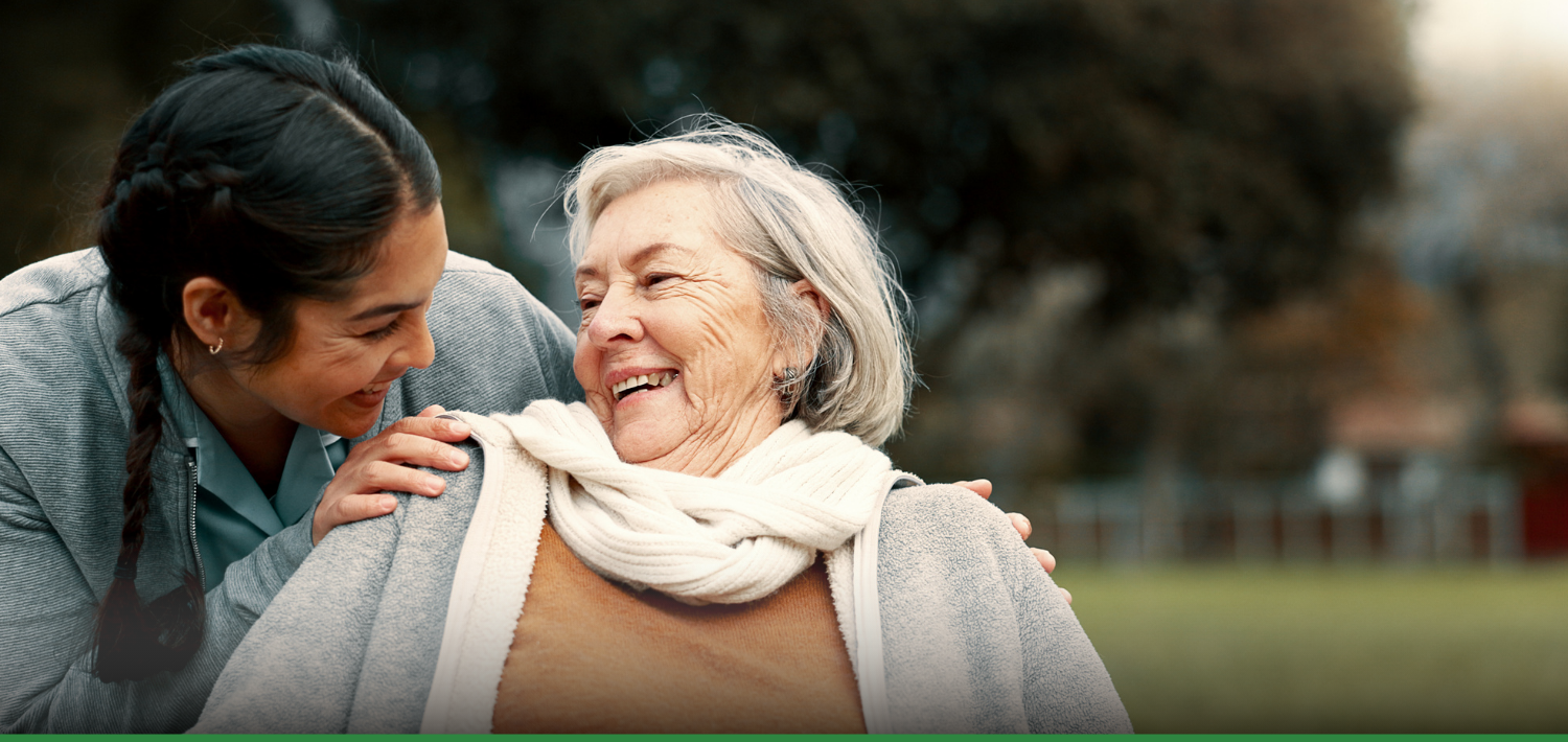 Two people outdoors discussing NHS Continuing Healthcare (CHC) funding, featured in Liaison Care blog offering five insights into CHC navigation.